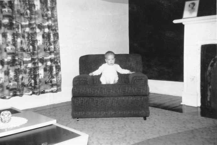 David as infant in chair