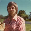 Mark in red checked shirt